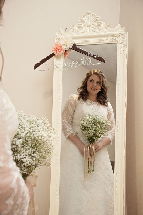 Gorgeous plus size bride wearing a sleeved A line dress