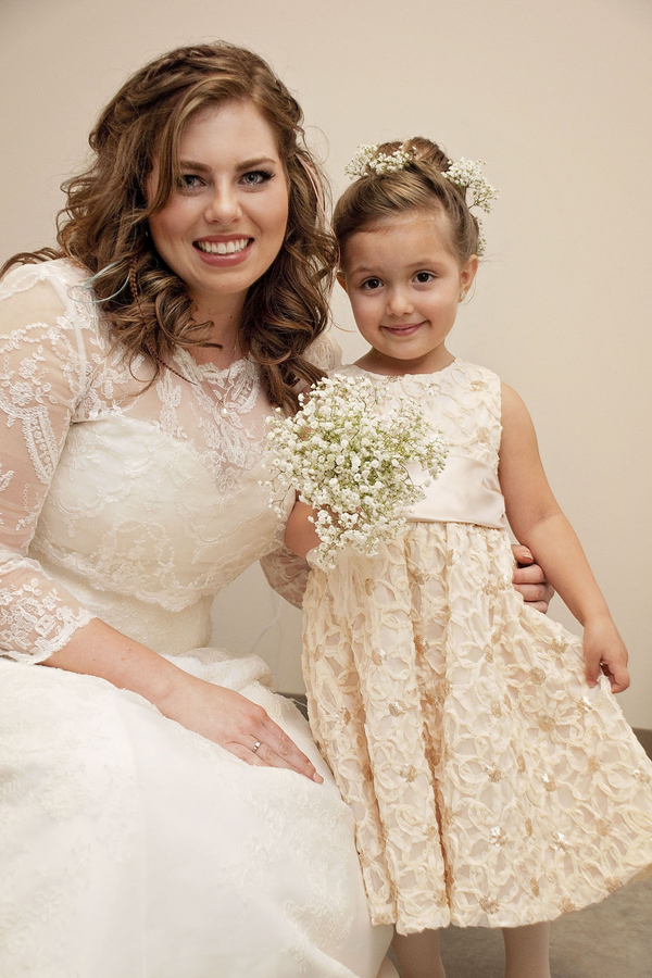Gorgeous plus size bride wearing a sleeved A line dress
