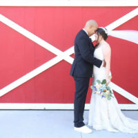 plus size bride with groom with her heirloom veil