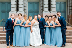 plus size bride and groom with wedding party wearing slate blue and navy