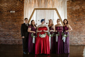 plus size bride, bridal party, red wedding dress, cape, bouquet ring