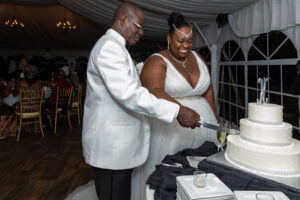 plus size bride, plus size wedding dress, wedding cake, black and white wedding decorations